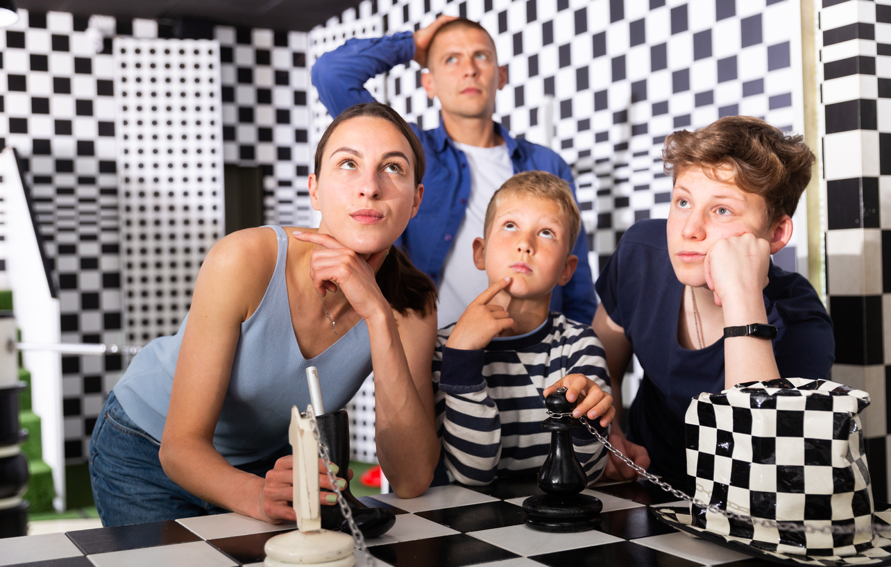 A family enjoying an escape room at EscapeTown as a birthday party activity in Central Illinois