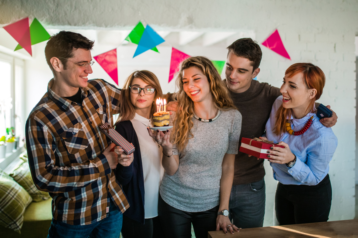 Group celebrating a friend’s birthday, getting ready to go to an escape room as a fun, interactive birthday party activity in Central Illinois